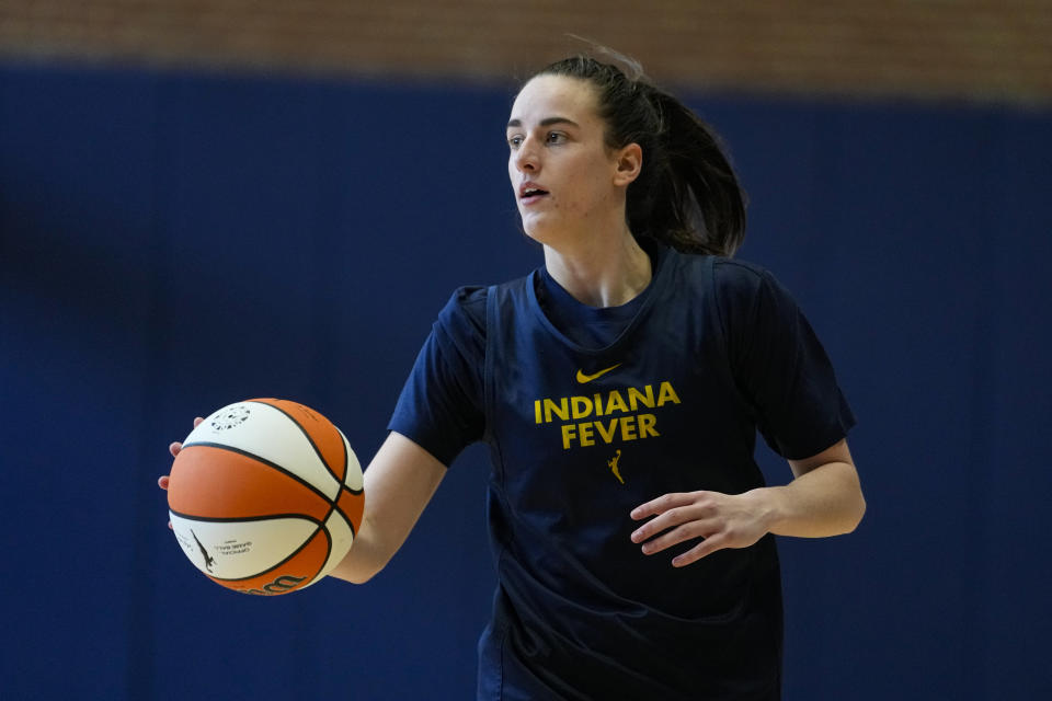 Indiana Fever guard Caitlin Clark brings the ball upcourt as the WNBA basketball team practices in Indianapolis, Sunday, April 28, 2024. (AP Photo/Michael Conroy)