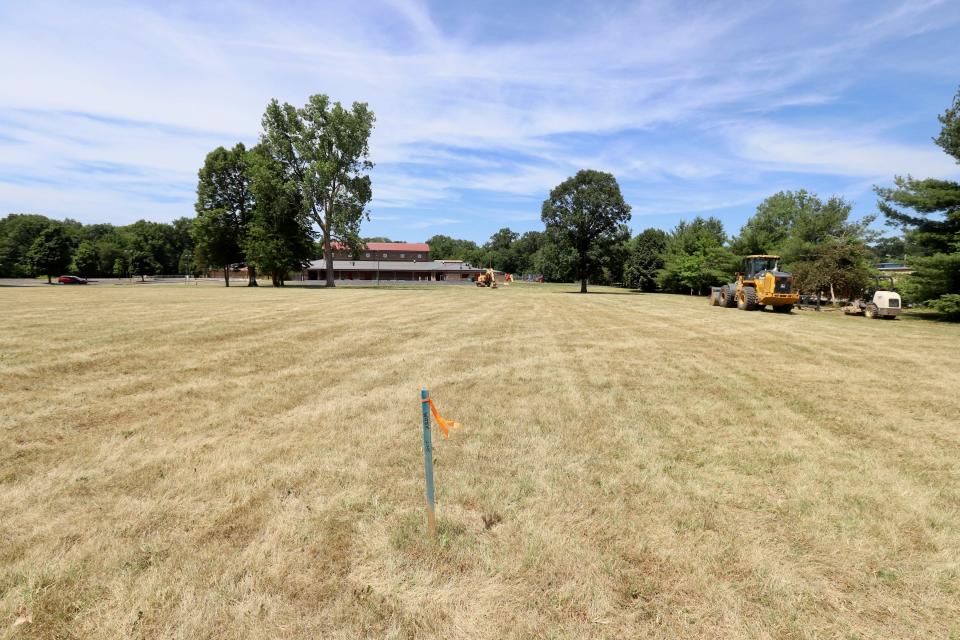 Earth-moving equipment sit Friday on property in front of Liberty Elementary School on McKinley Avenue in Mishawaka. The city is buying the land for its new fire station and is preparing to build an access road that the school and station will use in the future.