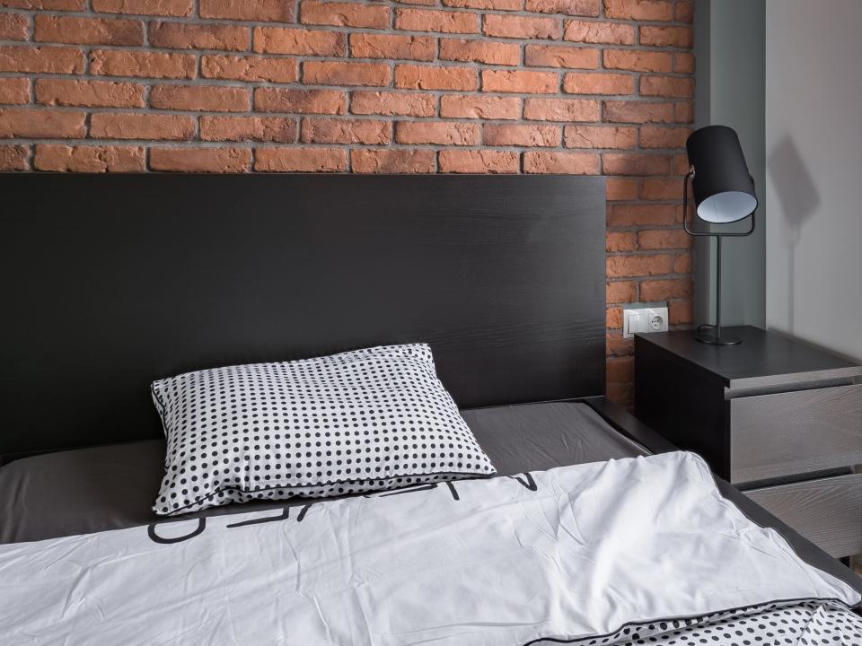 industrial style bedroom with brick