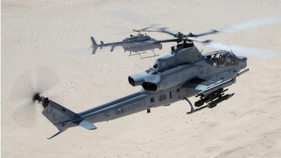 An AH-1Z Viper (front) with Marine Operational Test and Evaluation Squadron 1 (VMX-1), and an MQ-8C Fire Scout unmanned helicopter assigned to Helicopter Sea Combat Squadron 23 (HSC-23), conduct Strike Coordination and Reconnaissance Training near El Centro, California, March 10, 2022. The purpose of this exercise was to provide familiarization and concept development of manned-unmanned teaming. (U.S. Marine Corps photo by Lance Cpl. Jade Venegas)