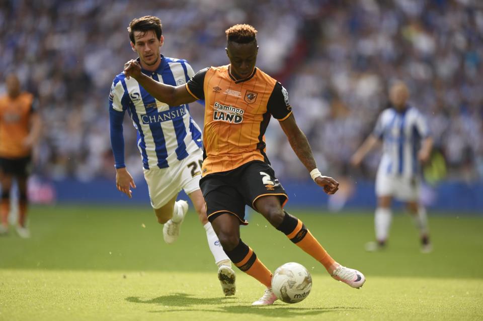 Britain Soccer Football - Hull City v Sheffield Wednesday - Sky Bet Football League Championship Play-Off Final - Wembley Stadium - 28/5/16 Hull City's Moses Odubajo in action with Sheffield Wednesday's Kieran Lee Action Images via Reuters / Tony O'Brien Livepic EDITORIAL USE ONLY. No use with unauthorized audio, video, data, fixture lists, club/league logos or "live" services. Online in-match use limited to 45 images, no video emulation. No use in betting, games or single club/league/player publications. Please contact your account representative for further details.