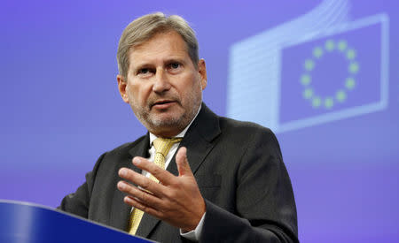 FILE PHOTO: European Neighbourhood Policy and Enlargement Negotiations Commissioner Johannes Hahn gestures as he addresses a news conference at the EU Commission headquarters in Brussels, Belgium, September 17, 2015. REUTERS/Francois Lenoir/File Photo