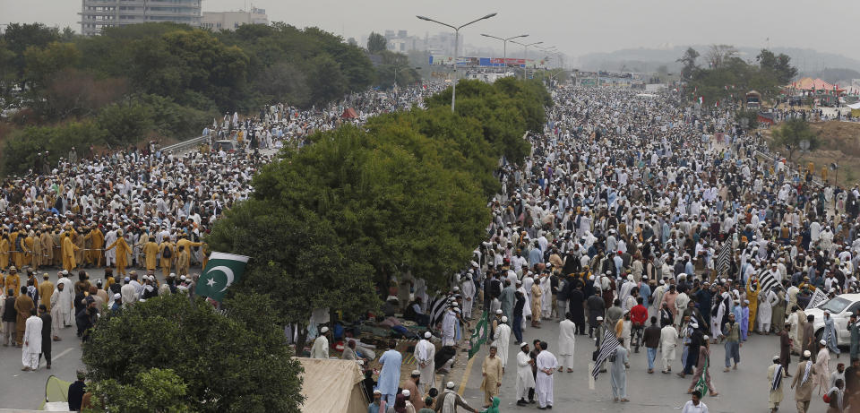 Supporters of a Pakistani radical Islamist party 'Jamiat Ulema-e-Islam' participate in an anti-government march, in Islamabad, Pakistan, Friday, Nov. 1, 2019. Thousands of members of a radical Islamist party have camped out in Pakistan's capital, demanding the resignation of Prime Minister Imran Khan over economic hardships. (AP Photo/Anjum Naveed)