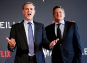 FILE PHOTO: Reed Hastings, co-founder and CEO of Netflix (L), and Netflix chief content officer Ted Sarandos pose on the red carpet at the French premiere of Netflix's TV series "Marseille" in Marseille