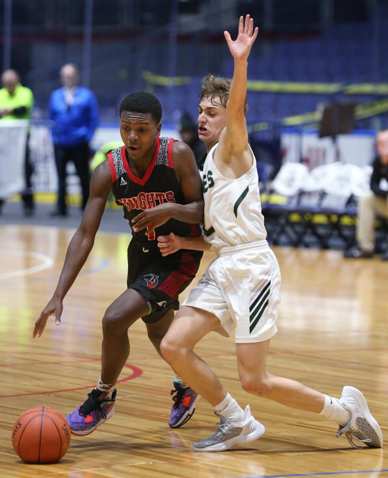 Northstar Christian's Justin Robinson tries to get around the tight defense from  Avon's Josh Harter.