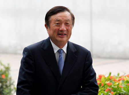 FILE PHOTO: Huawei CEO and founder Ren Zhengfei walks inside Huawei's headquarters in the southern Chinese city of Shenzhen, Guangdong province, China October 16, 2013. REUTERS/Bobby Yip/File Photo