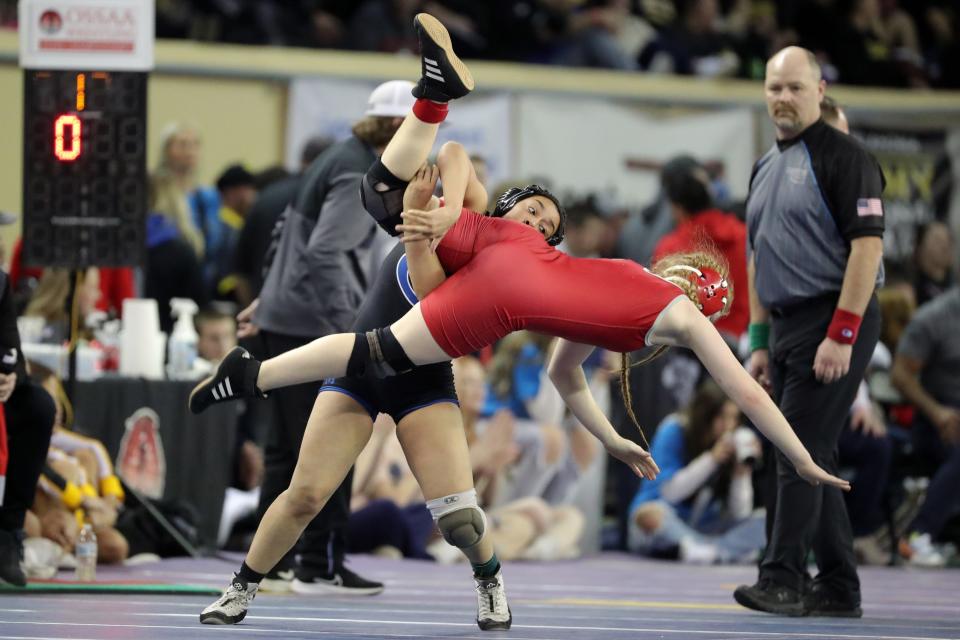 Khaleah Kirk of Guthrie, left, wrestles Janelle Lynch
of. Carl Albert in a 125-pound girls semifinal match during the Oklahoma state wrestling tournament at State Fair Arena in Oklahoma City, Friday, Feb. 24, 2023.