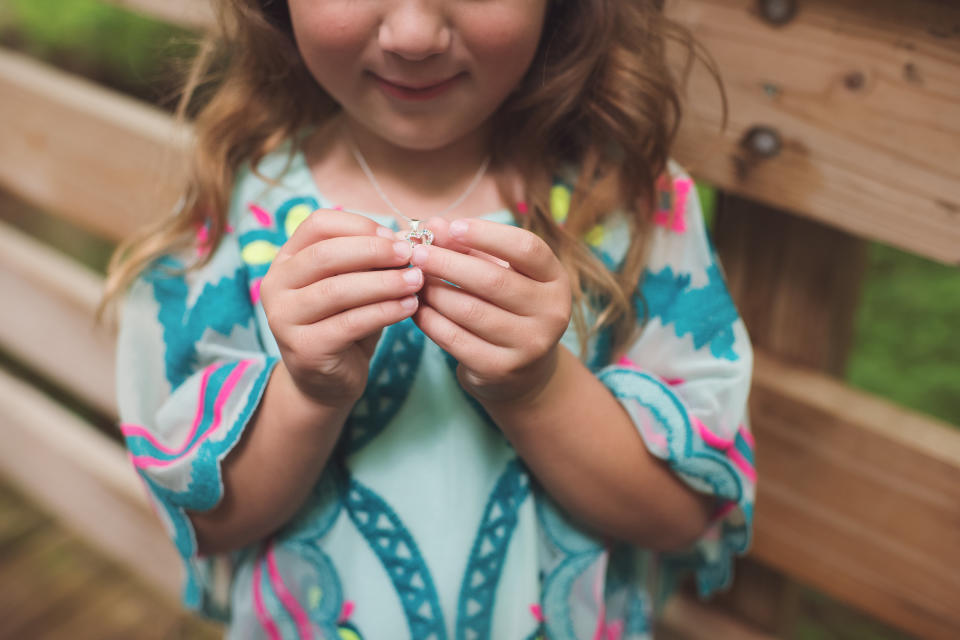 Adrianna showing off her necklace.&nbsp; (Photo: <a href="http://mandigillilandphotography.com/" target="_blank">Mandi Gilliland Photography</a>)