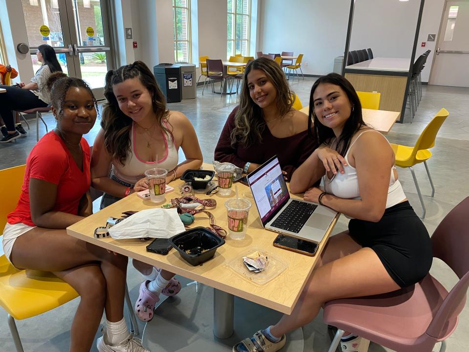 FSU freshman Carolina Ortega (far right), a Fort Lauderdale native who lives on the university's campus, sits with a few friends in FSU's Student Union building.