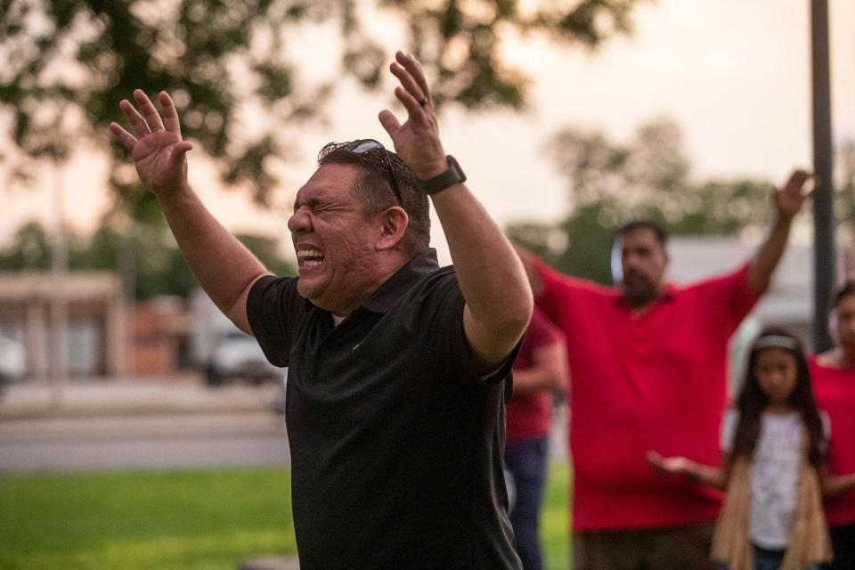 Community members gather in prayer at the Uvalde downtown plaza after the shooting at Robb Elementary School in Uvalde on May 24.