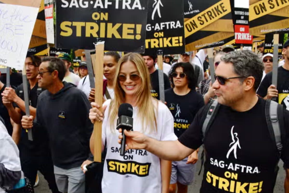 Margot Robbie marches at Netflix Studios as part of the strike (London Entertainment / Splash / Shutterstock)