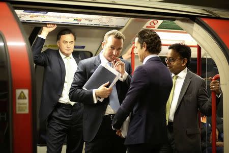 Men travel on the London underground in London, Britain August 5, 2015.REUTERS/Paul Hackett