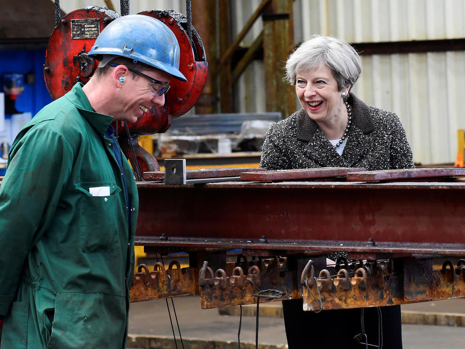 Prime Minister Theresa May speaks to a worker during a visit to a steel works in Newport, Wales: PA wire