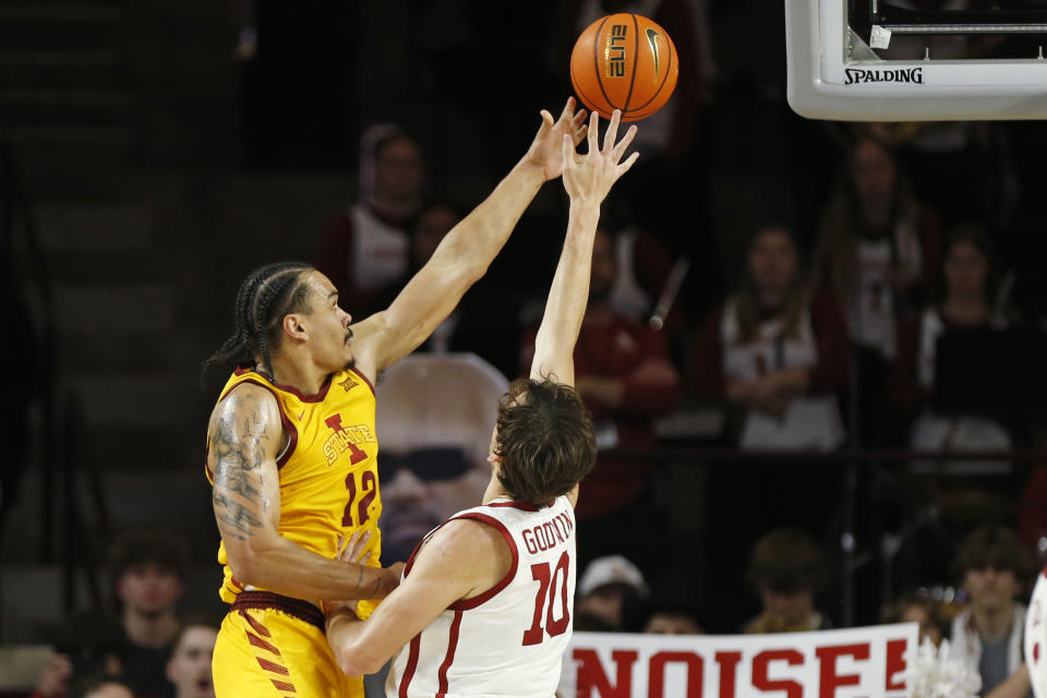 Iowa State forward Robert Jones (12) shoots against Oklahoma forward Sam Godwin (10) during the second half of an NCAA college basketball game, Saturday, Jan. 6, 2024, in Norman, Okla. (AP Photo/Nate Billings)