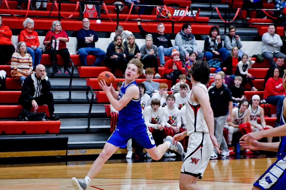 Van Meter's Cael Trudo drives to the basket during a game against Newton on Thursday, Feb. 9, 2023.