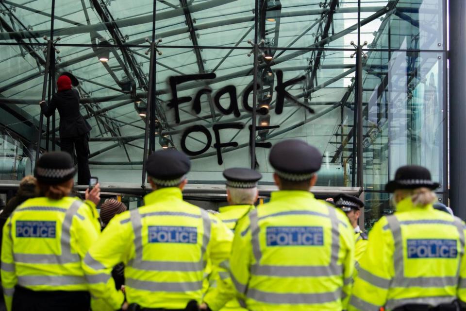 An Anti-fracking protester spray=painted the words