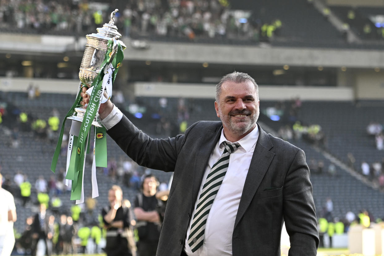 Ange Postecoglou with the Scottish Cup trophy he won with Glasgow Celtic in 2023. 