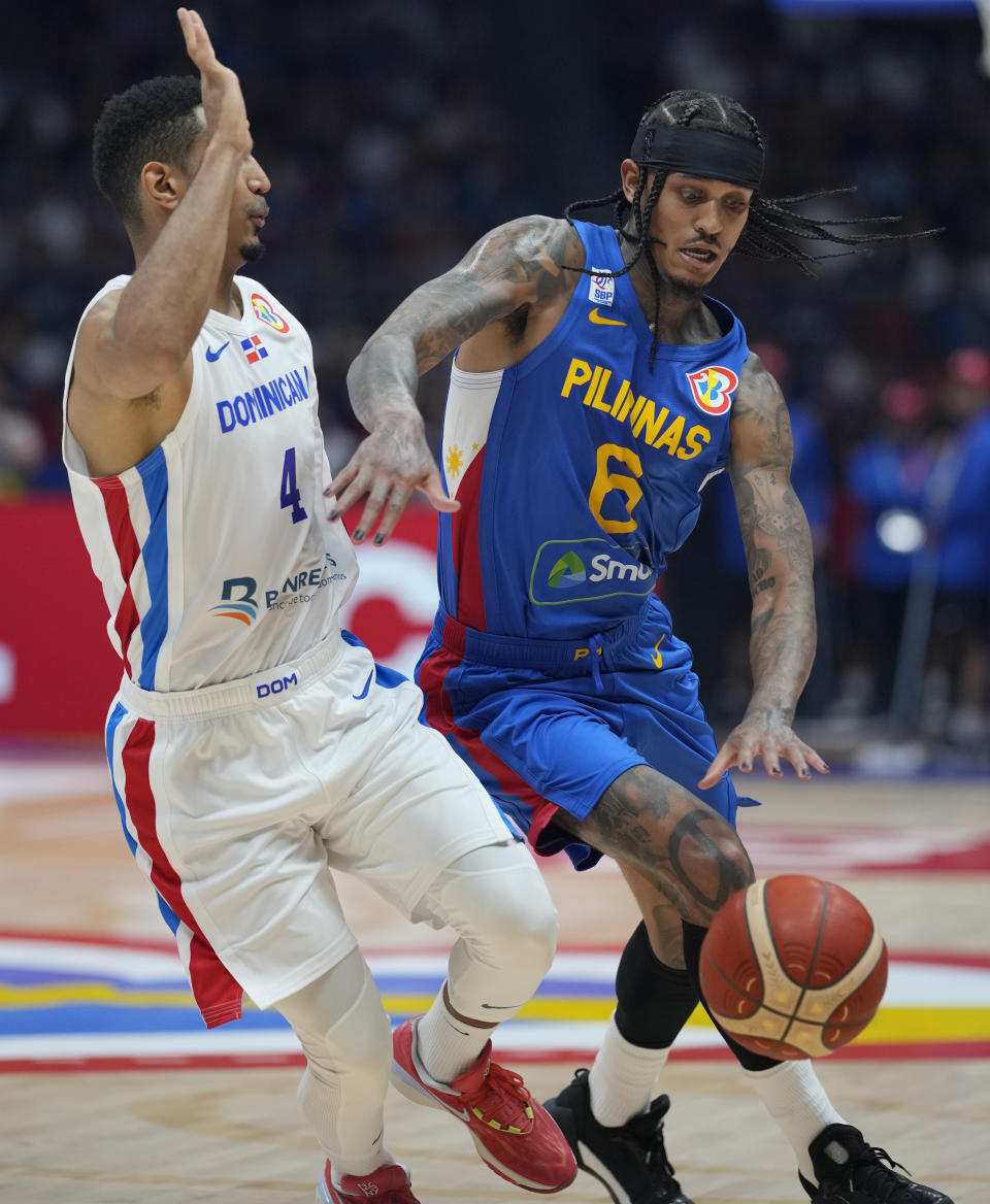 Philippines guard Jordan Clarkson (6) drives past Dominican Republic guard Gelvis Solano (4) during their match at the Basketball World Cup at the Philippine Arena in Bulacan province, Philippines Friday, Aug. 25, 2023. (AP Photo/Aaron Favila)