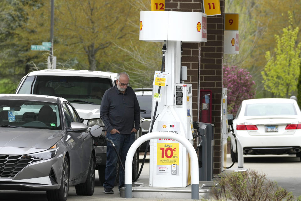 A customer fills up his vehicle's gas tank at a gas station in Buffalo Grove, Ill., Tuesday, April 23, 2024. On Tuesday, April 30, 2024, the Conference Board reports on U.S. consumer confidence for April. (AP Photo/Nam Y. Huh)