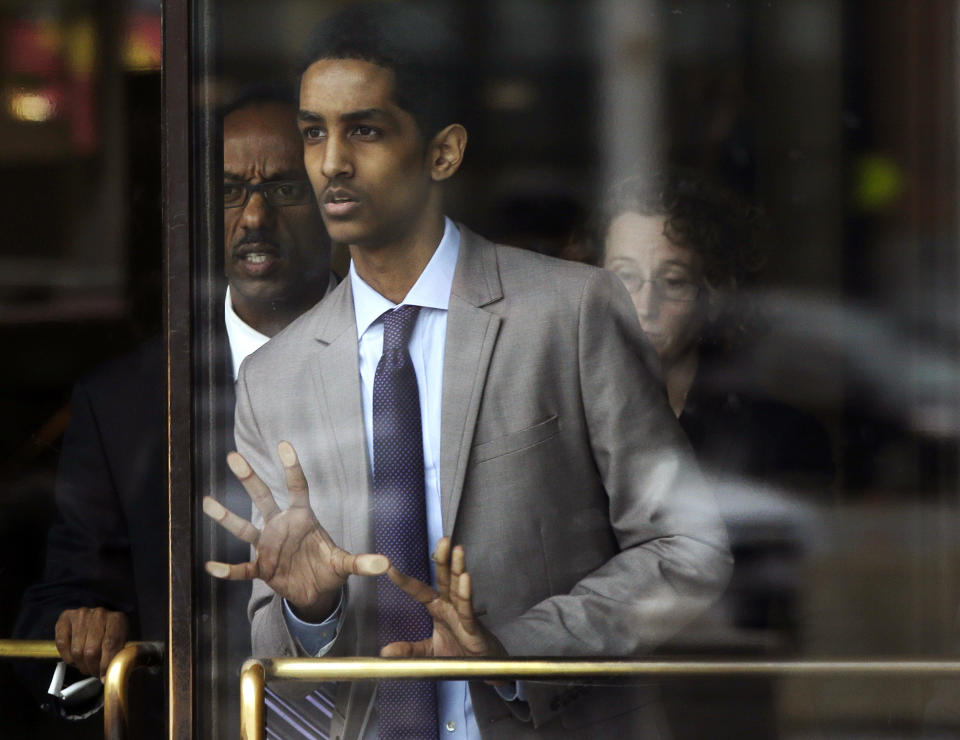 Robel Phillipos, a college friend of Boston Marathon bombing suspect Dzhokhar Tsarnaev, leaves federal court after a hearing Tuesday, May 13, 2014, in Boston. Phillipos, of Cambridge, Mass., is charged with lying to investigators after last year's fatal bombing. Judge Douglas Woodlock ruled Tuesday that separate trials will be held for Phillipos and two other of Tsarnaev's friends, Azamat Tazhayakov and Dias Kadyrbayev, but that their trials do not need to be moved out of Massachusetts. (AP Photo/Stephan Savoia)