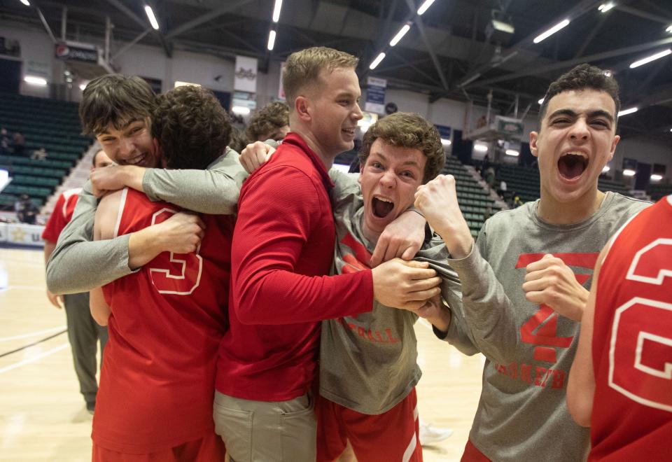 Tappan Zee celebrates after defeating Irondequoit 49-36 to win the NYSPHSAA Class A basketball championship at the Cool Insuring Arena in Glens Falls March 17, 2023.