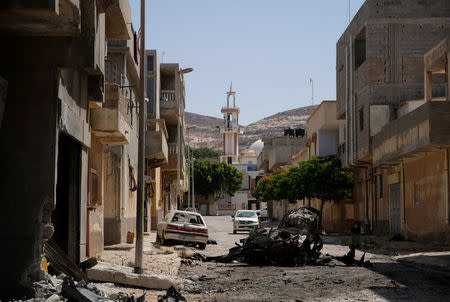 A view of destroyed buildings and cars after forces loyal to Libyan commander Khalifa Haftar took control of the area, in Derna, Libya June 13, 2018. Picture taken June 13, 2018. REUTERS/Esam Omran Al-Fetori