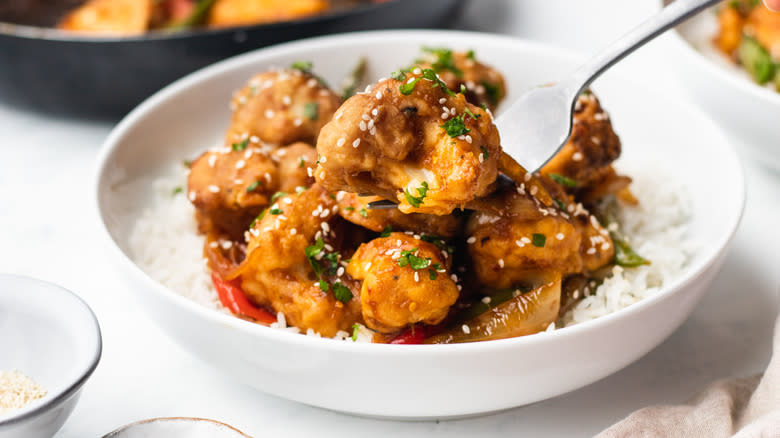 Sesame cauliflower stir fry forked out of bowl