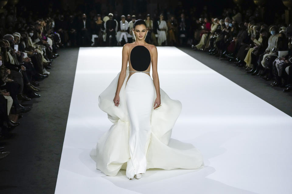 A model wears a creation for the Stephane Rolland Spring-Summer 2022 Haute Couture fashion collection, in Paris, Tuesday, Jan. 25, 2022. (AP Photo/Francois Mori)
