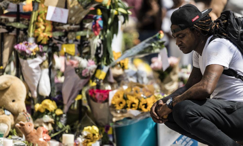 Flowers and mourning outside church near Grenfell Tower