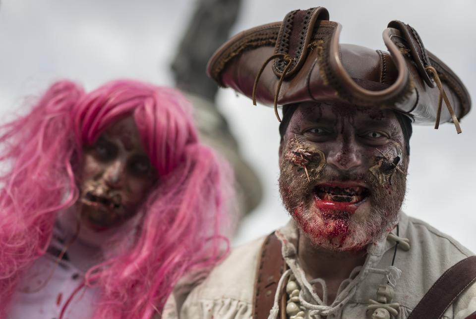 <p>A man dressed as a zombie participates in a walk for World Zombie Day 2017 on Place de la République in Paris, France, Oct.7, 2017. More than 50 cities worldwide participate in the worldwide horror festival in which revellers dress up as zombie-related characters. (Photo: EFE/EPA/IAN LANGSDON) </p>