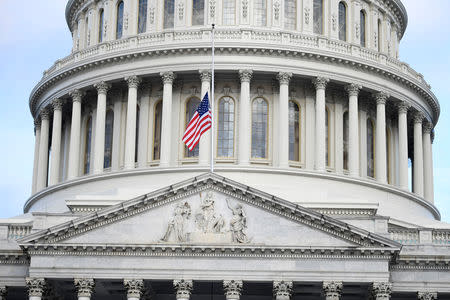 The American flag flies at half-staff over the U.S. Capitol, where the late Sen. John McCain will lie in state in the Rotunda for a memorial service, in Washington, DC, U.S., August 31, 2018. REUTERS/Mike Theiler