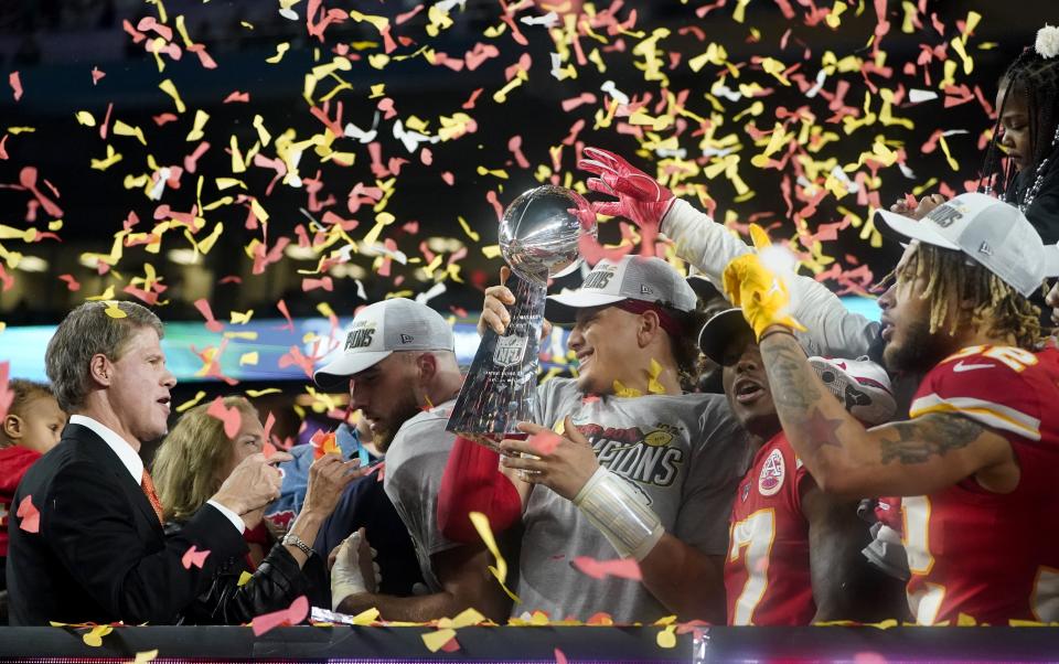 (L-R) CEO of the Kansas City Chiefs Clark Hunt, Tight End Travis Kelce, Quarterback Patrick Mahomes (holding the Lombardi trophy), Wide receiver Mecole Hardman and Strong safety Tyrann Mathieu celebrate after winning Super Bowl LIV between the Kansas City Chiefs and the San Francisco 49ers at Hard Rock Stadium in Miami Gardens, Florida, on February 2, 2020. (Photo by TIMOTHY A. CLARY / AFP) (Photo by TIMOTHY A. CLARY/AFP via Getty Images)