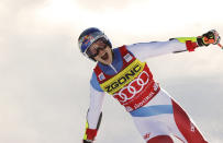 FILE - Switzerland's Marco Odermatt celebrates at finish area after winning an alpine ski, men's World Cup giant slalom race in Alta Badia, Italy, on Dec. 20, 2021. Looking for the Next Big Thing in Alpine skiing? Look no further than Marco Odermatt. The 24-year-old from Switzerland is a potential superstar who won five gold medals at the junior world championships in 2018 and is currently leading the overall World Cup standings. He’s a legitimate medal threat in three events at the upcoming Beijing Olympics with strong results in giant slalom, super-G and downhill this season. (AP Photo/Alessandro Trovati, File)