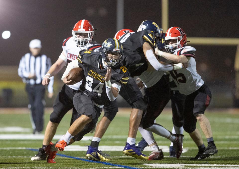 TRN Josh Moore breaks through the line in first half action. Toms River North football defeats  Kingsway in  Sectional Championship game in Toms River on November 11, 2022. 