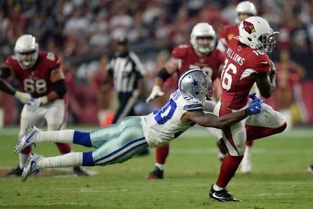 Sep 25, 2017; Glendale, AZ, USA; Dallas Cowboys cornerback Anthony Brown (30) makes a diving tackle against Arizona Cardinals wide receiver Chad Williams (16) during the second half at University of Phoenix Stadium. Mandatory Credit: Joe Camporeale-USA TODAY Sports