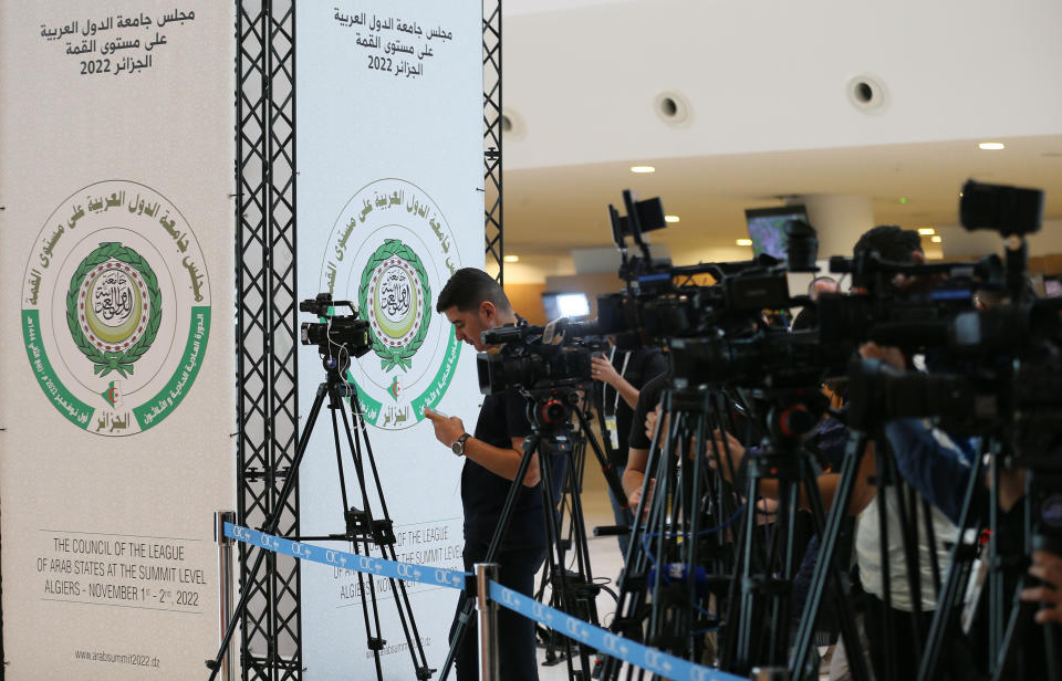 Members of the media film as ministers and delegates attend a preparatory meeting before the beginning of the Arab Summit in Algiers, Algeria, Monday, Oct. 31, 2022. Algeria is readying to host the 31st Arab League Summit, the first since the outbreak of the coronavirus pandemic. In the three years that's passed, new challenges have drastically reshaped the region's agenda, with the establishment of diplomatic ties between Israel and the gulf, and the fallout of the war in Ukraine. (AP Photo/Anis Belghoul)