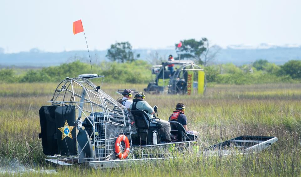 Firefighters and law enforcement officers use air boats to search the marsh off the Northeast Florida Regional Airport in St. Augustine during a training exercise on Wednesday, May 18, 2022.  
