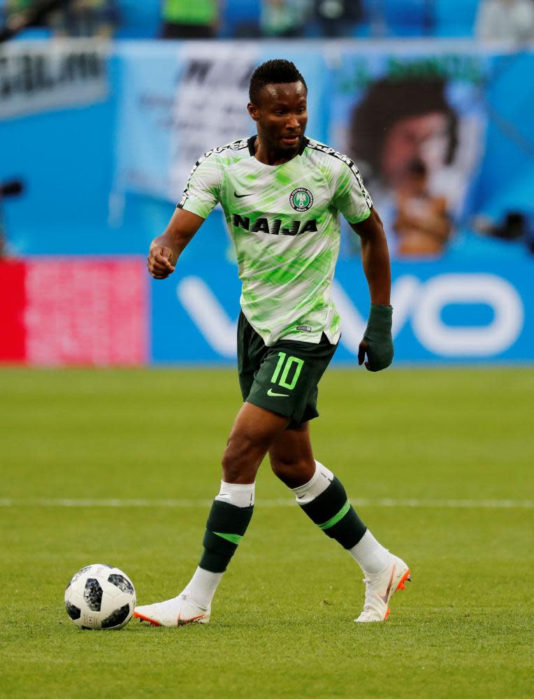 Nigeria’s John Obi Mikel showing off his kit during the warm up before the match against Argentina.