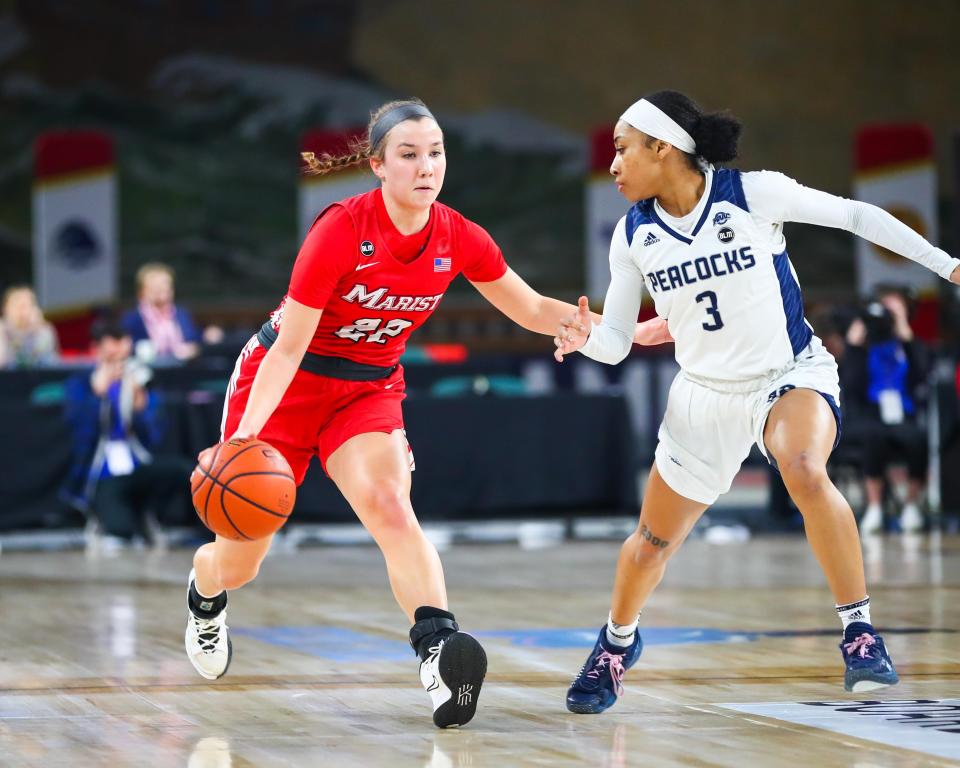 Marist guard Anabel Ellison (22) tries to dribble past Saint Peter's guard Nickelle O'Neil during Tuesday's Metro Atlantic first-round playoff game. Saint Peter's won 49-29. METRO ATLANTIC ATHLETIC CONFERENCE