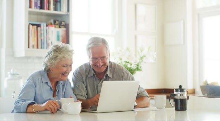 Retired couple checks their dividend payments