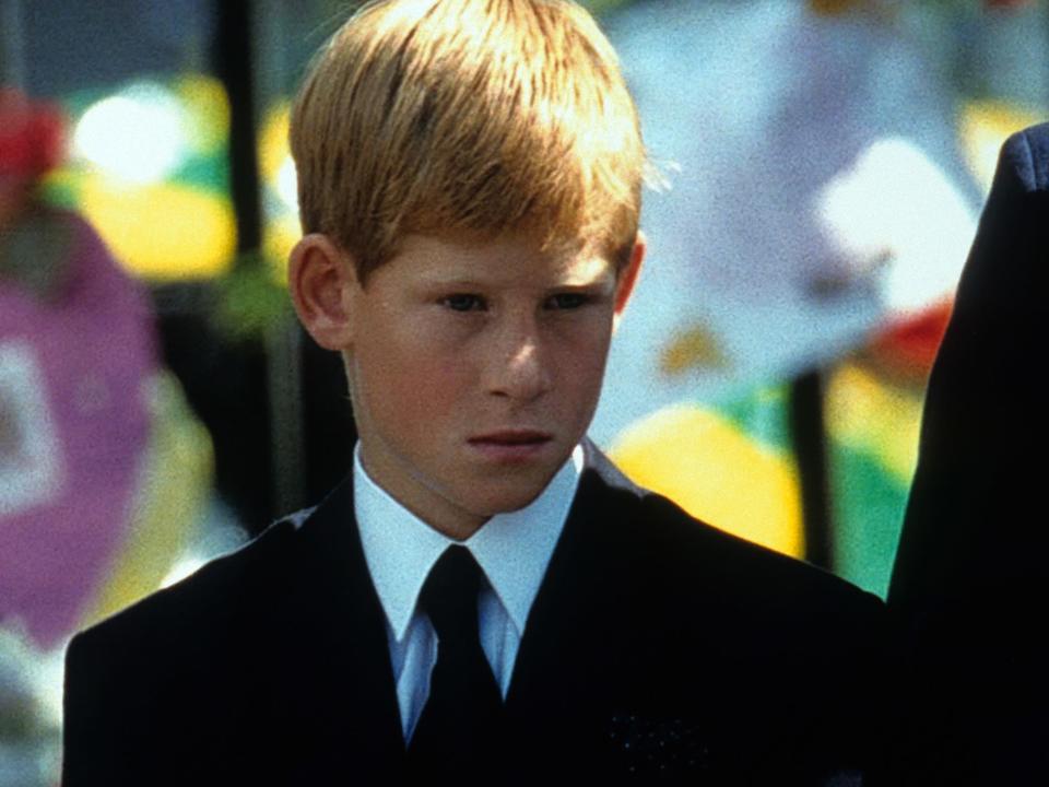 Prince Harry stands outside Westminster Abbey at the funeral of Diana, Princess of Wales on September 6, 1997