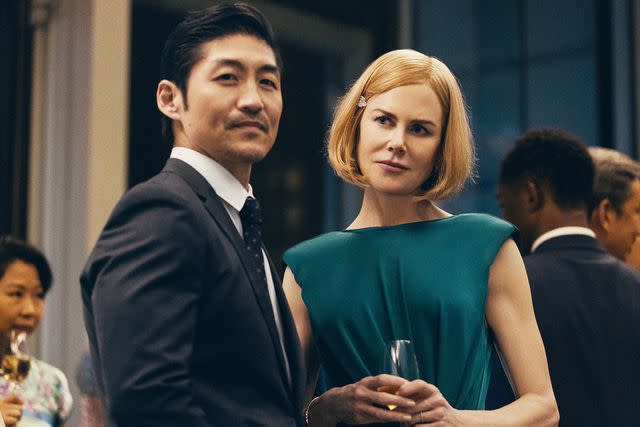 <p>Amazon MGM Studios</p> (L) Brian Tee and Nicole Kidman in 'Expats'