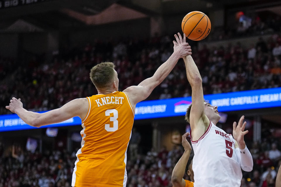 Tennessee's Dalton Knecht (3) fouls Wisconsin's Tyler Wahl (5) during the second half of an NCAA college basketball game Friday, Nov. 10, 2023, in Madison, Wis. (AP Photo/Andy Manis)
