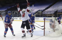 New Jersey Devils' Miles Wood celebrates a second-period goal against the New York Rangers in an NHL hockey game Tuesday, Jan. 19, 2021, in New York. (Bruce Bennett/Pool Photo via AP)