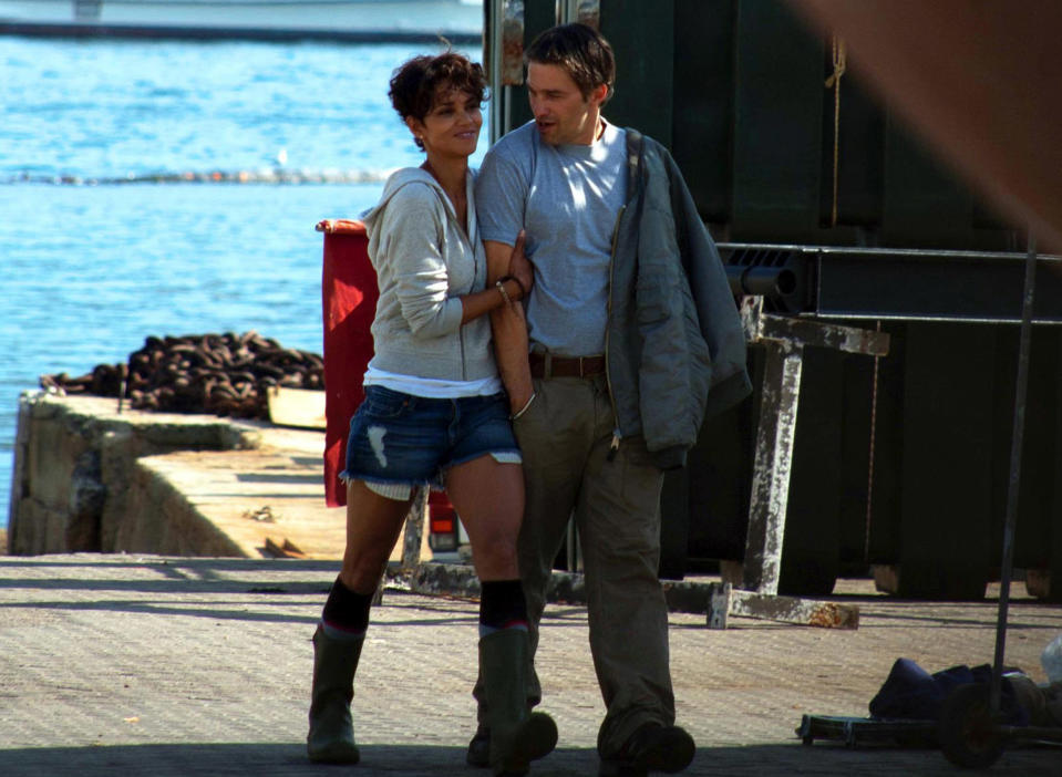 CAPE TOWN, SOUTH AFRICA - AUGUST 12: (SOUTH AFRICA, UAE, BRAZIL OUT) American actress Halle Berry and co star Olivier Martinez at the False Bay Yacht Club where they are filming the movie Dark Tide, on 12 August 2010 in Simons Town, South Africa. The movie is a thriller centered on a diving instructor and a Great White Shark. (Photo by Chad Chapman/Gallo Images/Getty Images)