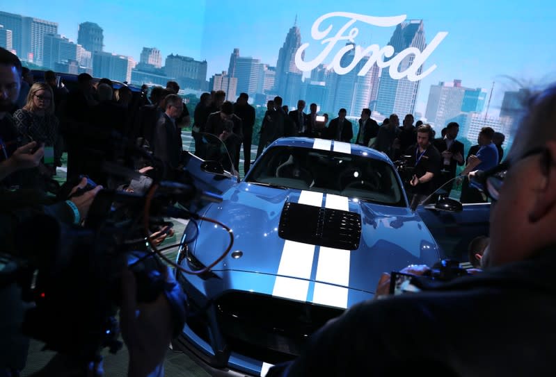 Media members with Ford Mustang Shelby GT500 at the North American International Auto Show in Detroit, Michigan