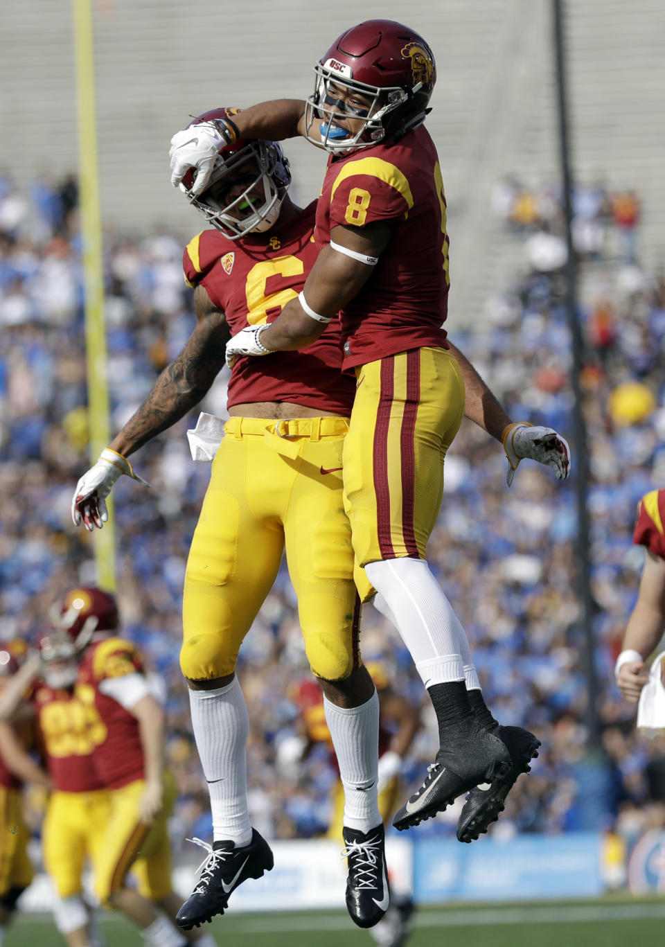 Southern California 's Amon-Ra St. Brown (8) celebrates his touchdown reception with teammate Michael Pittman Jr. during the first half of an NCAA college football game against UCLA, Saturday, Nov. 17, 2018, in Pasadena, Calif. (AP Photo/Marcio Jose Sanchez)