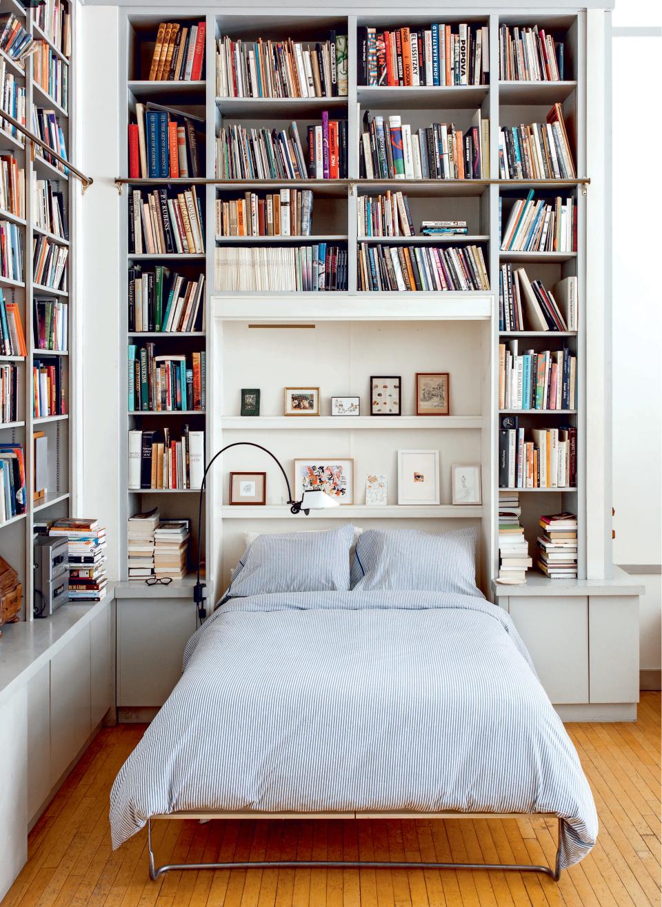 Keep the rest of the room minimal so floor-to-ceiling books can shine. Illustrator Joana Avillez sleeps surrounded by books in her own personal library.
