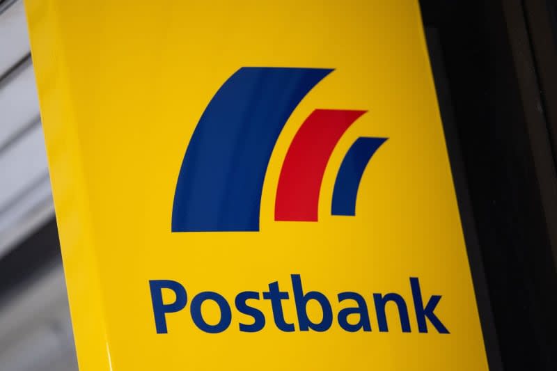 The Postbank logo can be seen at a branch. Marijan Murat/dpa