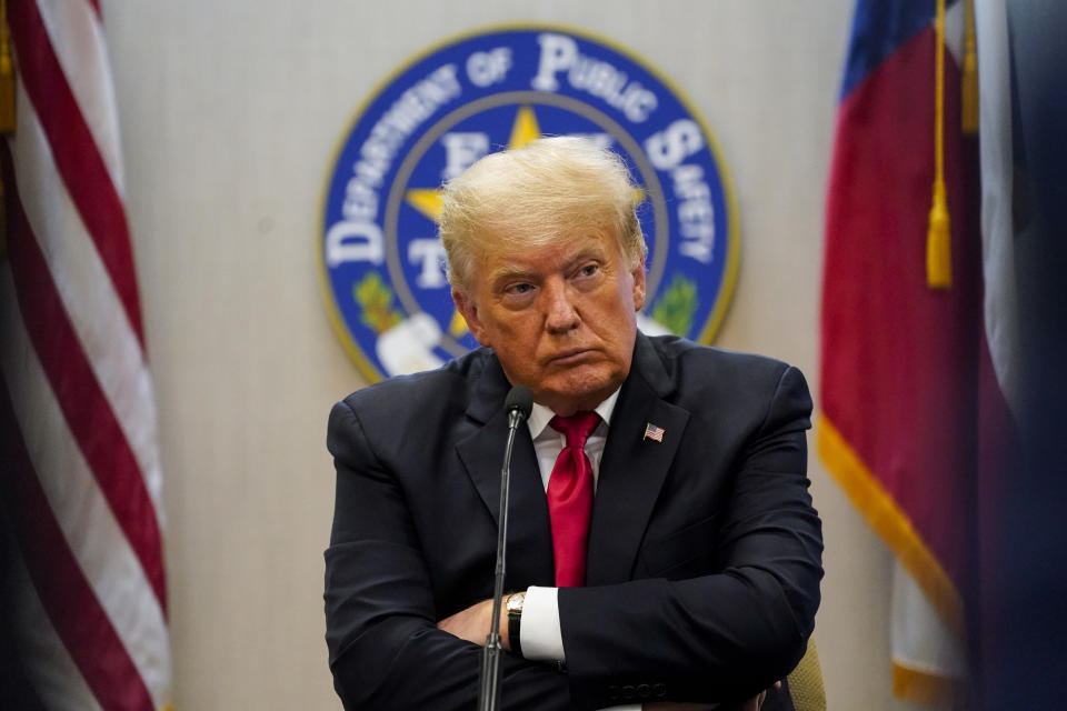 Former President Donald Trump attends a briefing with state officials and law enforcement at the Weslaco Department of Public Safety DPS Headquarters before touring the US-Mexico border wall on Wednesday, June 30, 2021 in Weslaco, Texas. Trump was invited to South Texas by Gov. Greg Abbott, who has taken up Trump's immigration mantle by vowing to continue building the border wall. (Jabin Botsford/The Washington Post via AP, Pool)